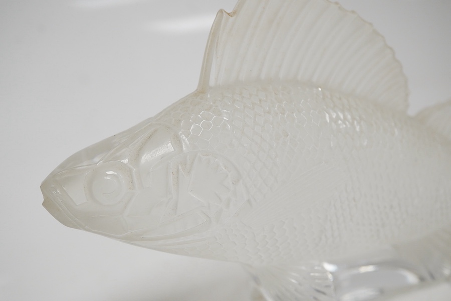 A modern Lalique glass paperweight in the form of a fish, signed to the base, 16cm wide. Condition - good